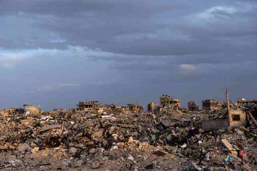 Buildings lie in ruins amidst the rubble in Rafah, in the southern Gaza Strip, on December 8, 2025.