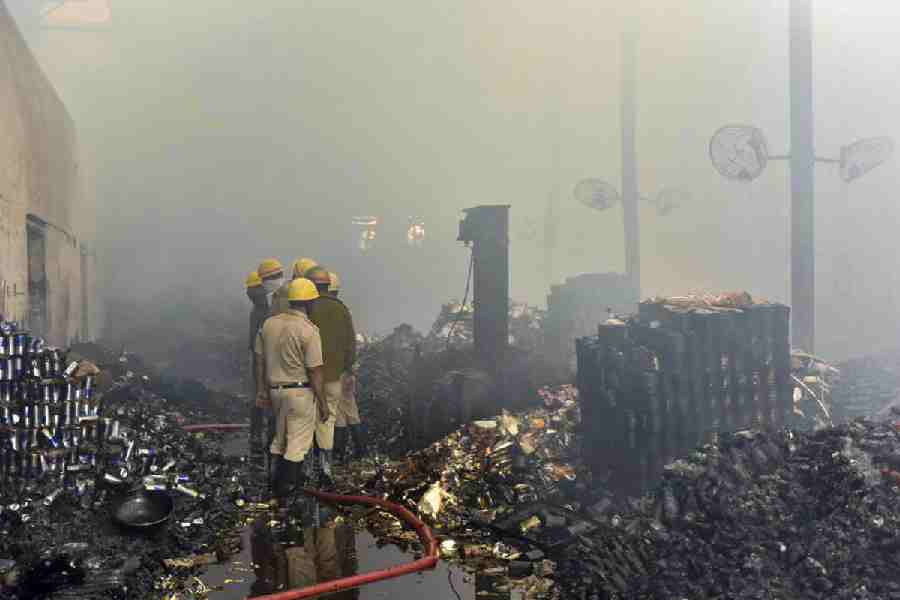 Fire brigade personnel douse a fire at a warehouse, in Kolkata, Monday, Jan. 26, 2026. A fire broke out in a warehouse in the Nazirabad area of Anandapur, Kolkata, in the early hours of Monday, causing at least seven feared deaths and multiple missing persons.