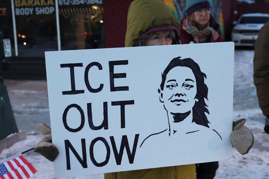 A demonstrator holds an ilustration of Renee Nicole Good, who was fatally shot by a US Immigration and Customs Enforcement (ICE) agent on January 7, as people protest against the presence of federal immigration agents in Minneapolis, Minnesota, US, January 28, 2026.