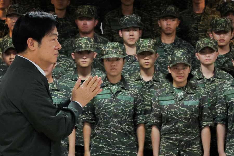 Taiwan President Lai Ching-te claps while he visits a military camp in Taoyuan, Taiwan