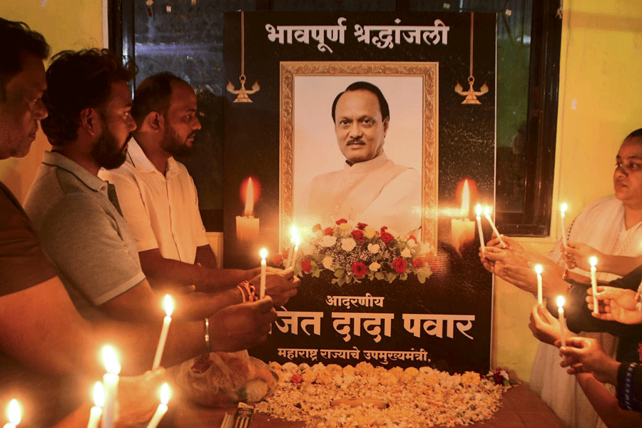 Supporters of the Nationalist Congress Party (NCP) hold a candlelight vigil to pay tribute to late Maharashtra Deputy Chief Minister Ajit Pawar, in Mumbai, Thursday, Jan. 29, 2026.
