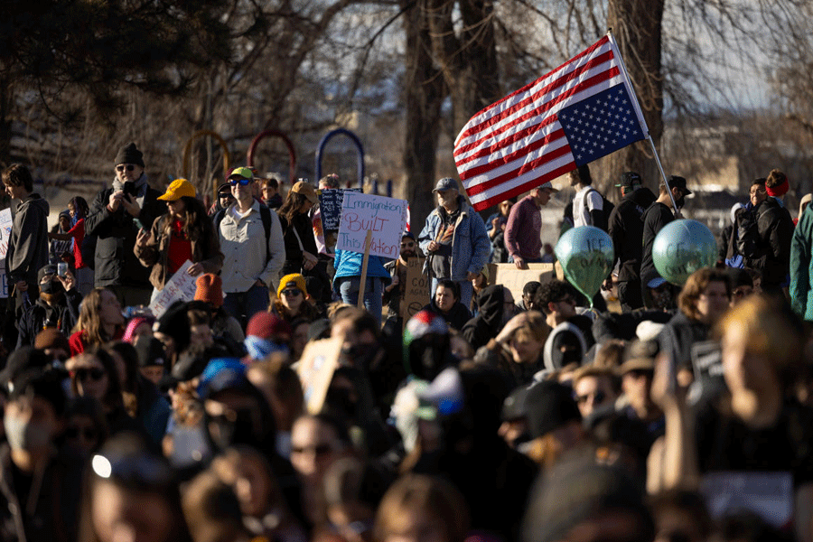 Demonstrators take part in an "ICE OUT" protest in Denver