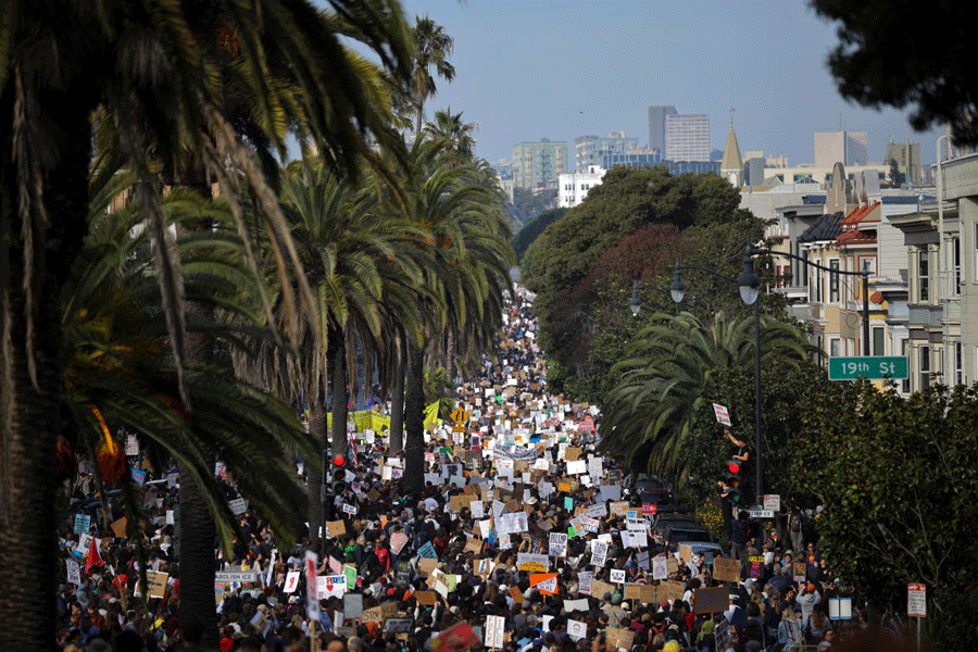 Demonstrators take part in an "ICE Out" protest, at Mission Dolores park in San Francisco