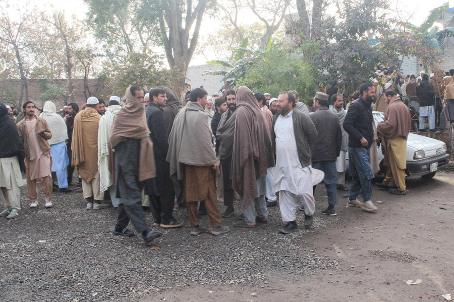 Residents from Tirah valley, who fled a remote mountainous region bordering Afghanistan, gather to get themself registered, in Bara