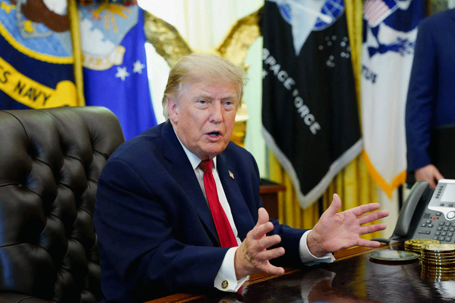 FILE PHOTO: U.S. President Donald Trump signs an executive order in the Oval Office at the White House