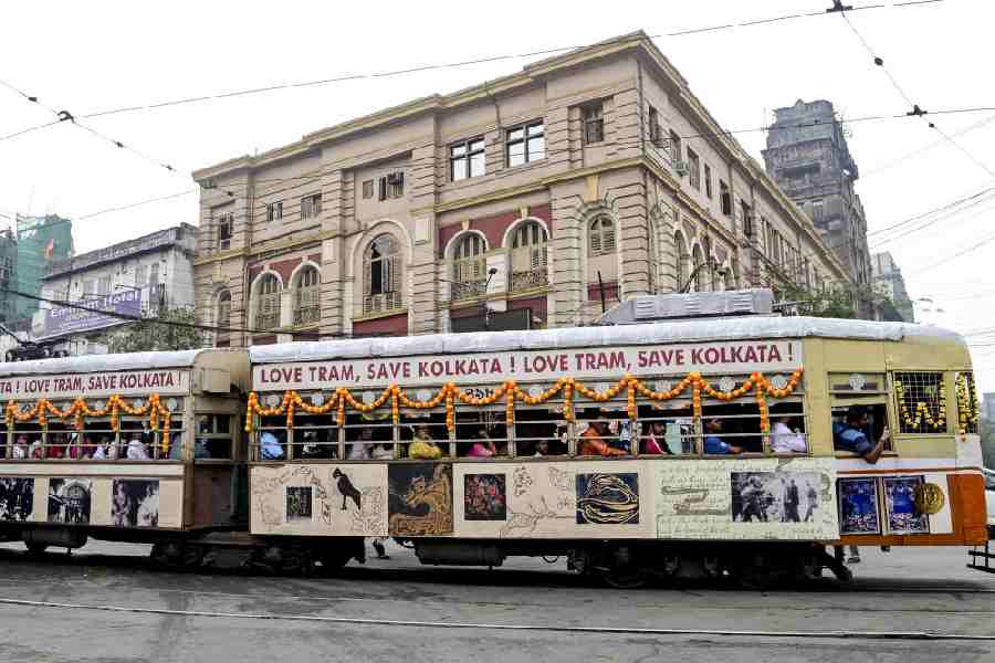 People ride tram No. 498 Gitanjali, a wooden tram built during World War II, during a special heritage run to mark the 153rd anniversary of the Calcutta tram service, in Kolkata, Tuesday, Feb. 24, 2026.