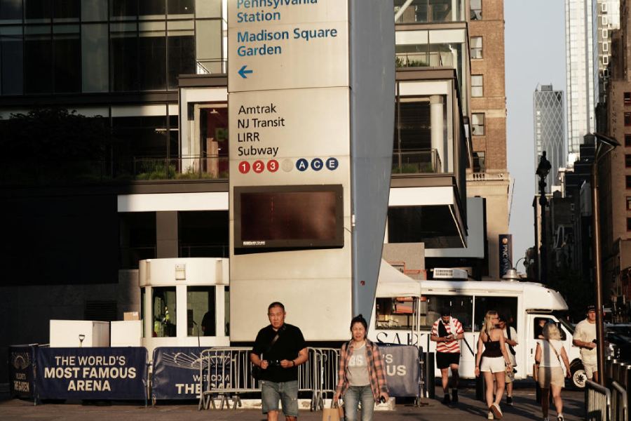 Pedestrians walk past Penn Station and Madison Square Garden, ahead of a reported wedding between singer Taylor Swift and National Football League player Travis Kelce
