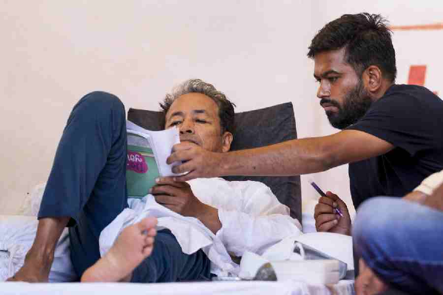 Sonam Wangchuk, an Indian education reformer, who has been on hunger strike, rests on stage during a sit-in protest called by CJP demanding the resignation of Indian Education Minister Dharmendra Pradhan, at Jantar Mantar in New Delhi, India, July 14, 2026.