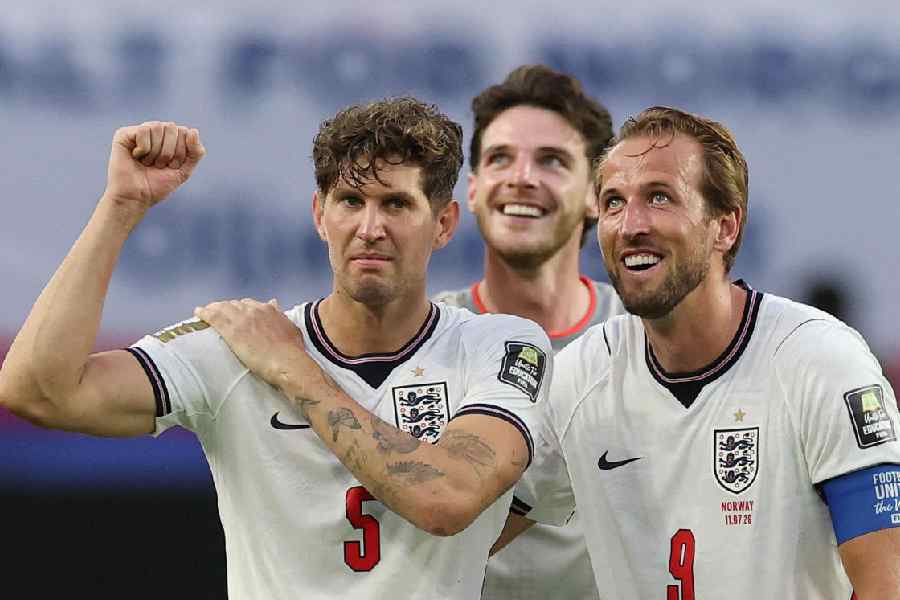 England's Harry Kane and John Stones celebrate after defeating Norway in the FIFA World Cup 2026 quarter-final in Miami, sealing England's place in the semi-finals, on July 11, 2026.