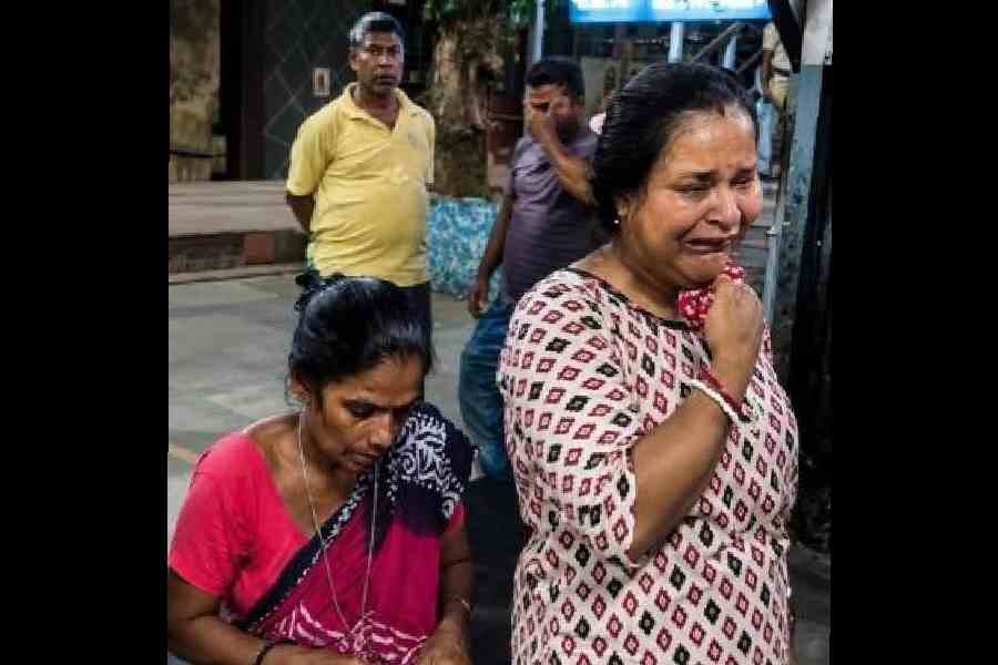 A hawker breaks down on the platform of the Dum Dum railway station after her kiosk was demolished early on Sunday