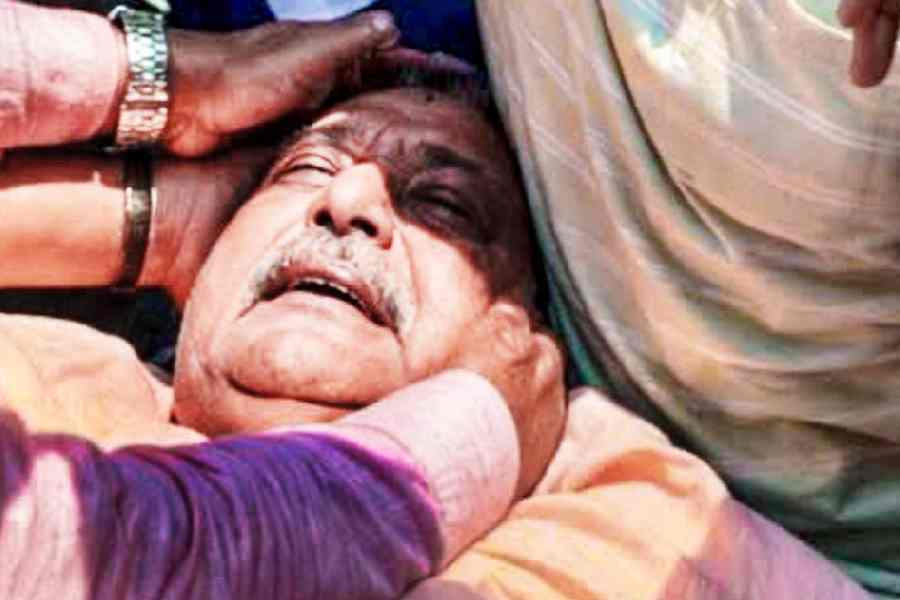 Kalyan Banerjee receives assistance after being allegedly attacked near Chanditala police station in Hooghly on Sunday. 
