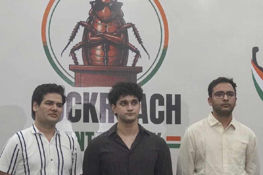 Cockroach Janta Party (CJP) chief spokespersons Saurav Das, centre, Vijeta Dahiya, left, and Ashutosh Ranka, right, during a press conference