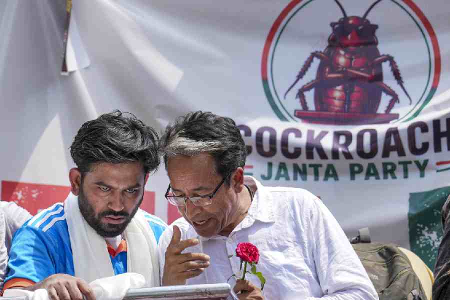 Cockroach Janta Party (CJP) founder Abhijeet Dipke, left, and Climate activist Sonam Wangchuk during a protest demanding the resignation of Union Education Minister Dharmendra Pradhan over alleged examination-related lapses, at the Jantar Mantar, in New Delhi, Saturday, June 6, 2026.