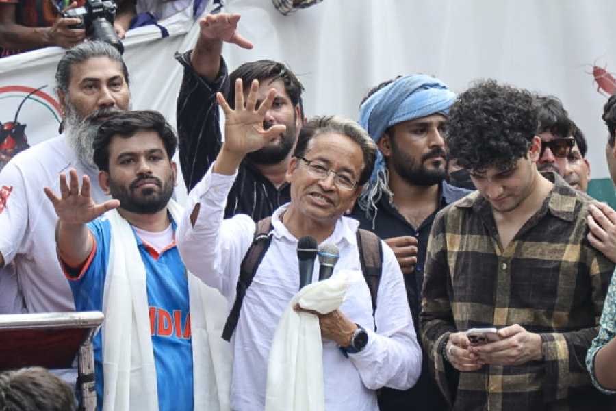 Cockroach Janta Party (CJP) founder Abhijeet Dipke, in blue, its spokesperson Saurav Das, and Climate activist Sonam Wangchuk during a protest demanding the resignation of Union Education Minister Dharmendra Pradhan over alleged examination-related lapses, at the Jantar Mantar, in New Delhi, Saturday, June 6, 2026.