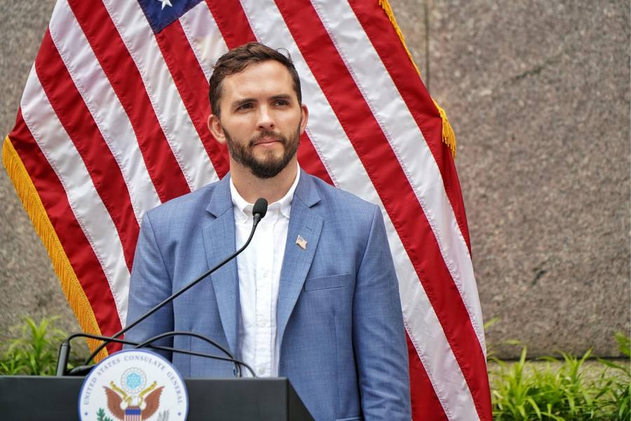 Matthew Godwin, regional security officer for the US consulate in Kolkata, observes a minute of silence for the fallen soldiers