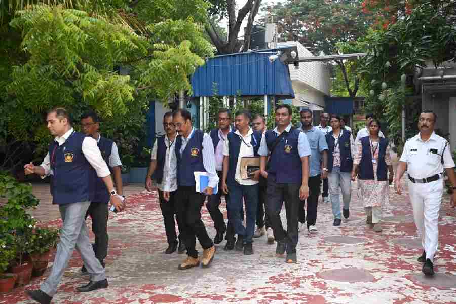 The CID team at 30B, Harish Chatterjee Street, which houses the Trinamool central office that was searched on Tuesday and Mamata Banerjee’s home. 