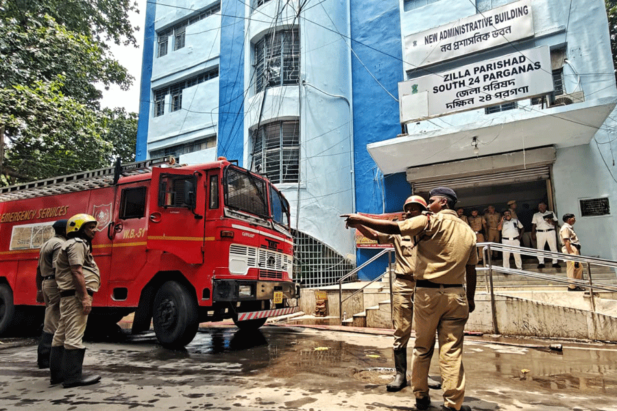 Firefighters battle a massive blaze that erupted at South 24 Parganas Zilla Parishad building in Kolkata on Wednesday.