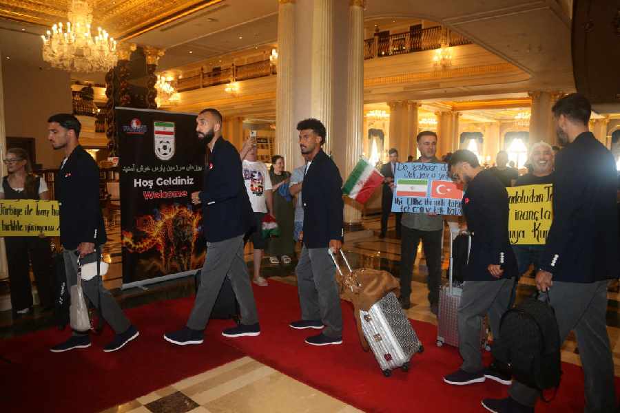 Iran's Ramin Rezaeian and Rouzbeh Cheshmi departs from their hotel as they travel from Turkey to Mexico ahead of the World Cup