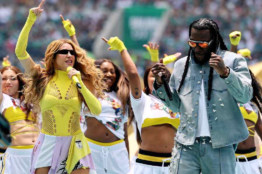 Shakira and Burna Boy perform during the opening ceremony. (Reuters)