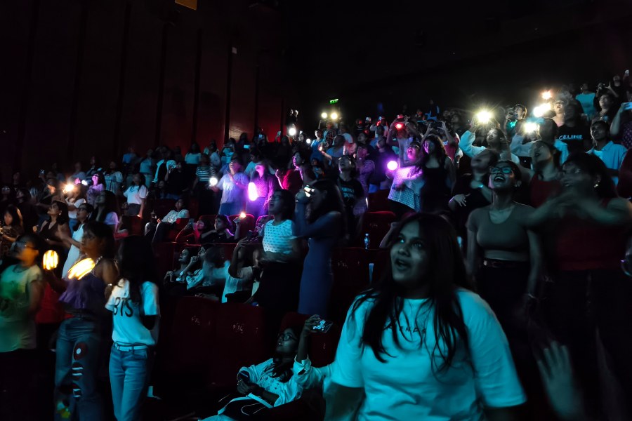 The audience during the live screening at Mani Square