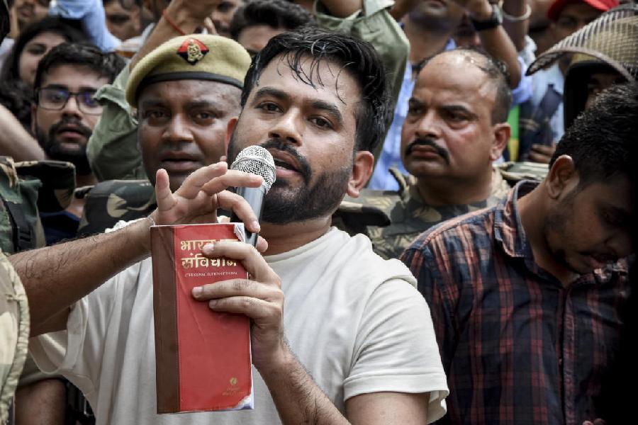 Cockroach Janata Party (CJP) founder Abhijeet Dipke addresses the gathering during a protest demanding the resignation of Union Education Minister Dharmendra Pradhan, in Lucknow, Uttar Pradesh, Friday, June 12, 2026.