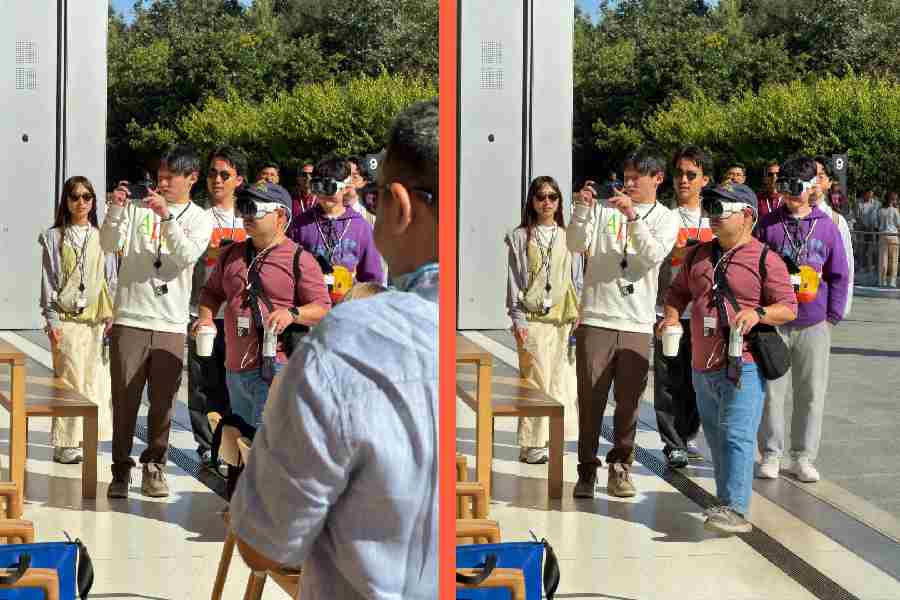 A complicated picture from which the man blocking the view of those wearing Apple Vision Pro has been removed using the High Quality option in Clean Up