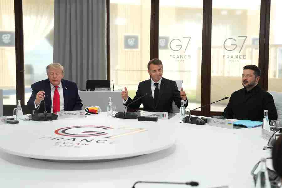 From left, US President Donald Trump, French President Emmanuel Macron and Ukrainian President Volodymyr Zelenskyy during a working session at the G7 summit in Evian-les-Bains, France, Tuesday, June 16, 2026.