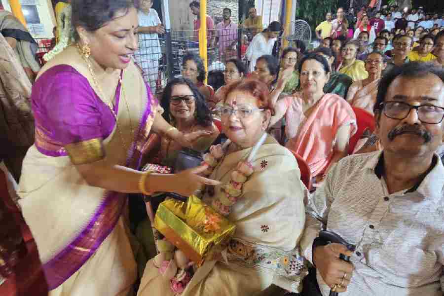 Dhruba Mukherjee, the new MLA’s mother, being felicitated