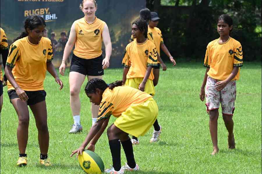 Kids engage in a game of rugby