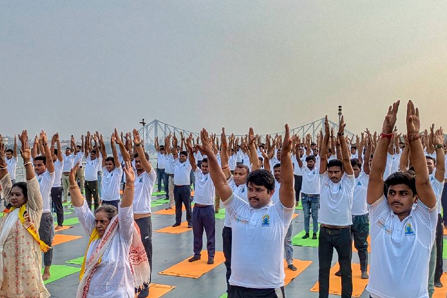 People celebrate Yoga Day at Millennium Park