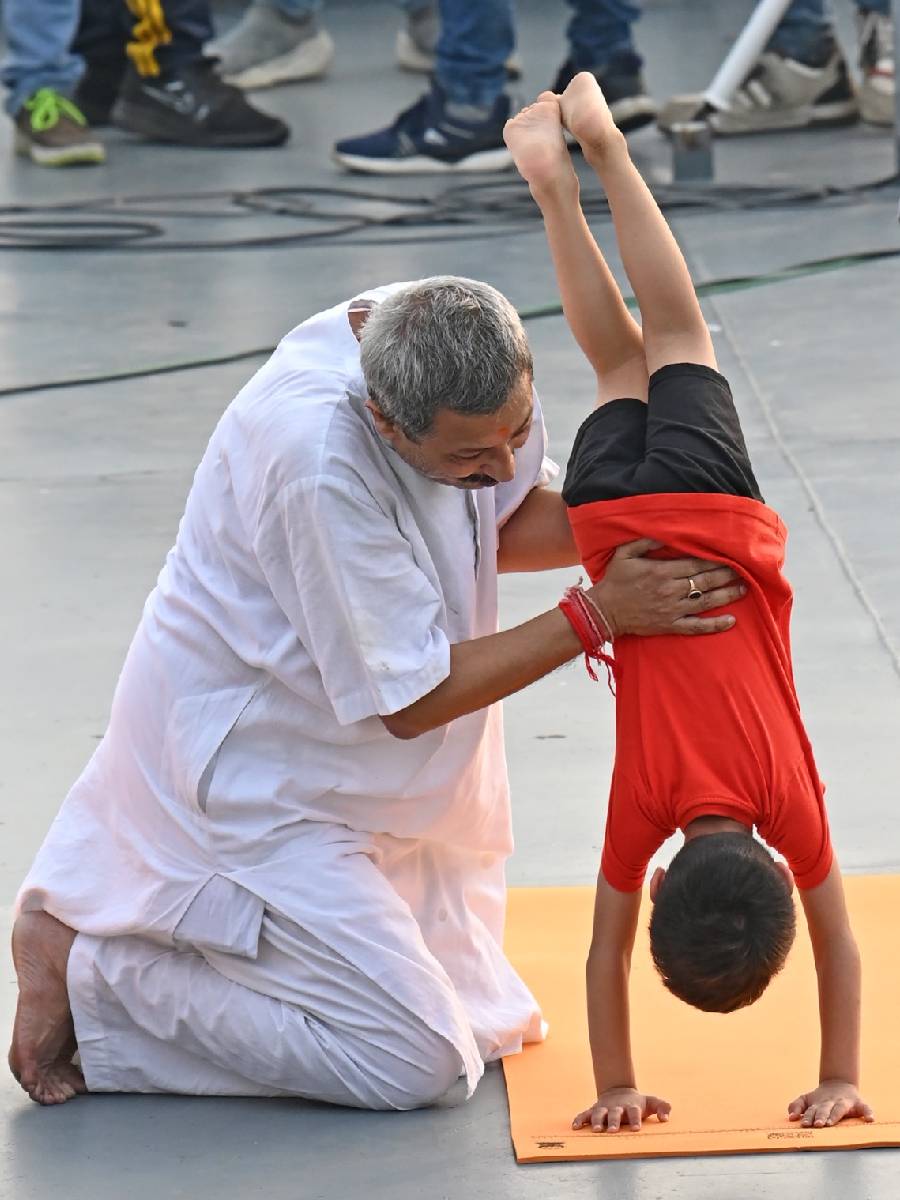 A young enthusiast is helped by his family, at Millennium Park