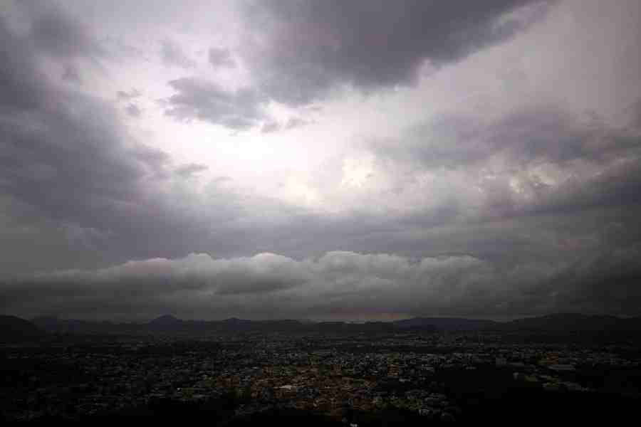 Dark clouds hover over the city during the pre-monsoon season, in Ajmer, Rajasthan, Saturday, June 13, 2026.