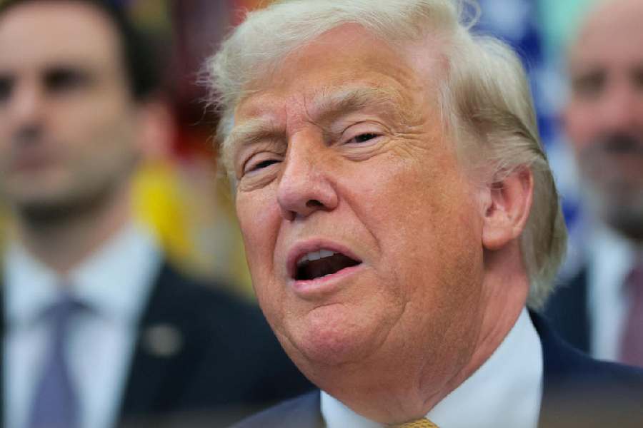 President Donald Trump speaks to reporters before signing two executive orders regarding quantum computing, in the Oval Office at the White House in Washington, D.C., U.S., June 22, 2026.