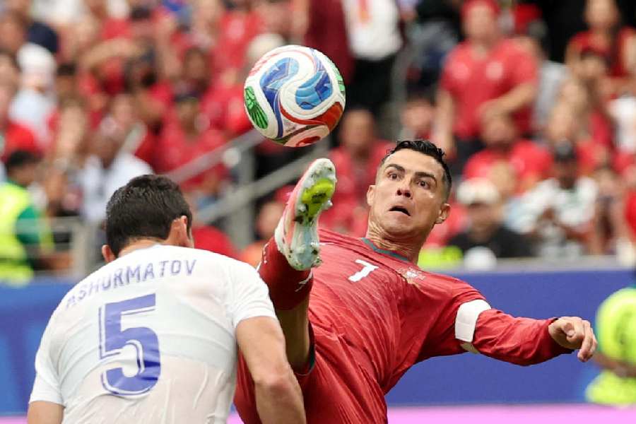Portugal's Cristiano Ronaldo in action with Uzbekistan's Rustam Ashurmatov at Houston Stadium, Houston, Texas, US, June 23, 2026
