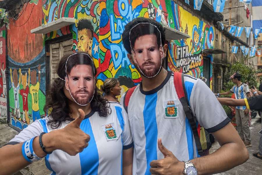 Fifa Gali, in Fariapukur saw visitors in Messi masks posing for photographs