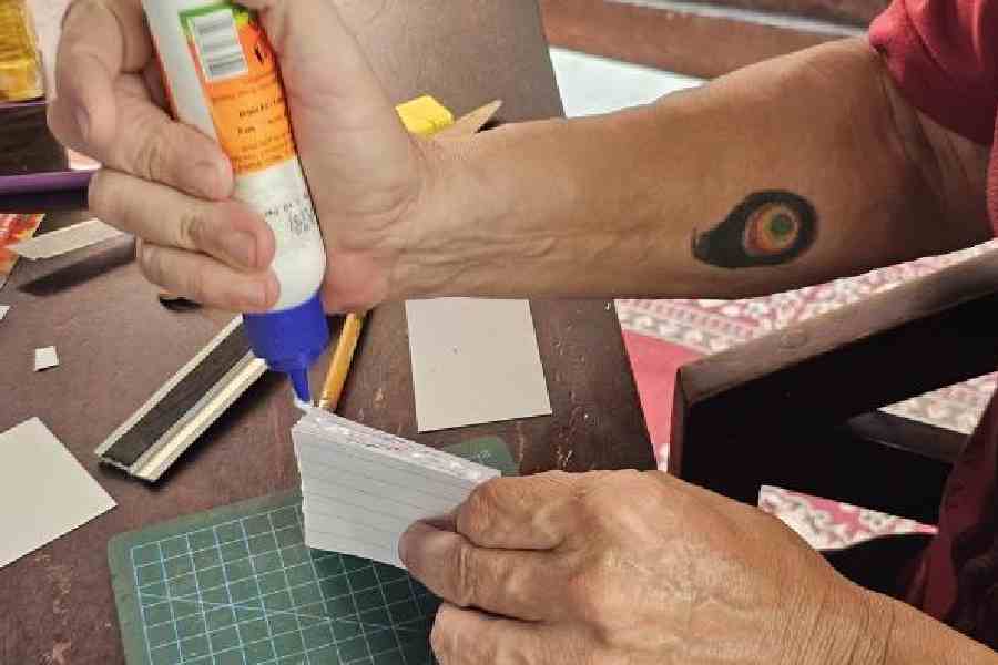 Spread glue evenly across the spine of the pages