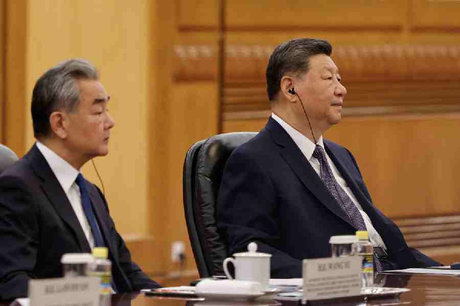 Chinese President Xi Jinping and Foreign Minister Wang Yi attend a meeting with Bangladesh\\\\\\\'s Prime Minister Tarique Rahman (not pictured), at the Great Hall of the People, in Beijing, China June 26, 2026.