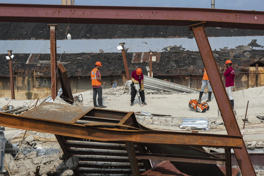 Rescue personnel carry out operations at the site of an under-construction warehouse collapse in the Taratala area, in Kolkata, Friday, June 26, 2026. Rescue efforts continued for the third consecutive day following the incident.