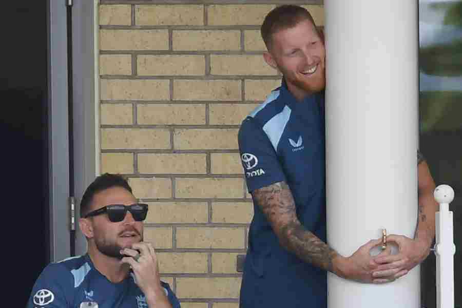 Ben Stokes and Brendon McCullum watch the action from the dressing room balcony at Trent Bridge on Monday.
