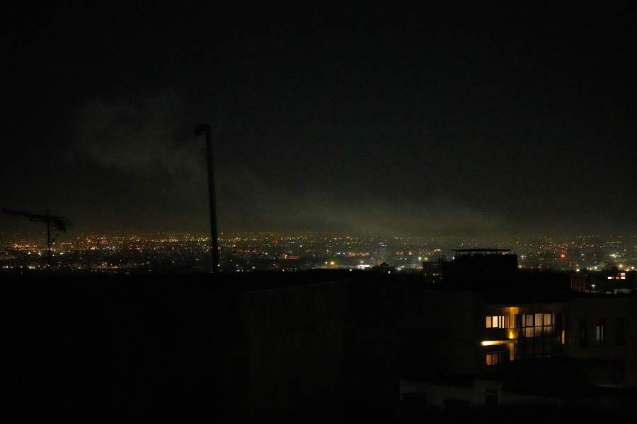 Smoke rises over Tehran’s skyline after an explosion on Saturday.