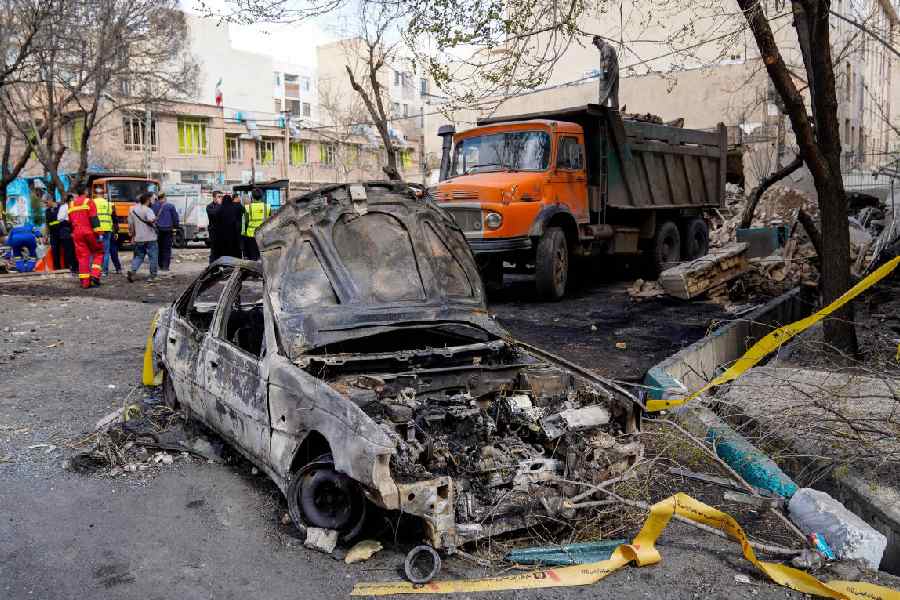 Remains of a car after a strike in Tehran.
