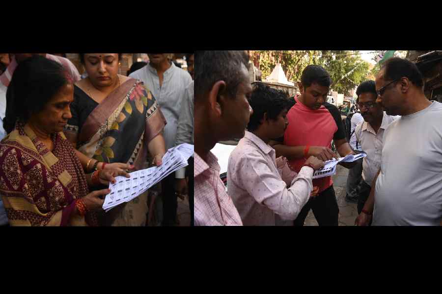 Voters in the Bhowanipore Assembly constituency look for their names in the electoral rolls published on Saturday. 