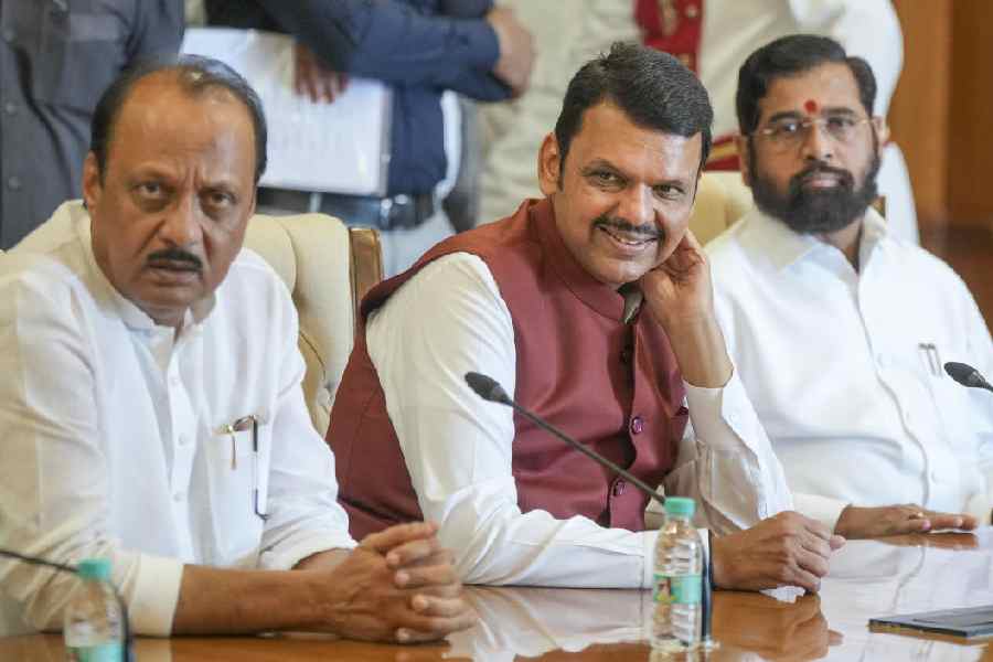 BJP leader Devendra Fadnavis with Shive Sena chief Eknath Shinde and NCP chief Ajit Pawar at the Governor house to stake claim for formation of the new government, in Mumbai, Wednesday, Dec. 4, 2024.