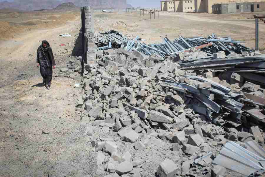 An Afghan man walks past a damaged wall following airstrikes, amid the conflict between Afghanistan and Pakistan, in Kandahar, Afghanistan, February 28, 2026.