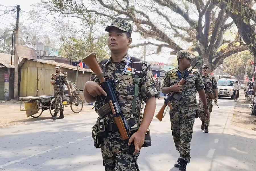 Paramilitary force personnel conduct a route march at Bongaon in North 24-Parganas on Saturday, on the day the final voter list was published.