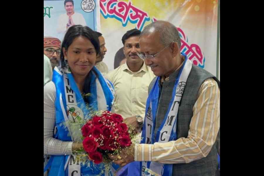 Mayor Gautam Deb with heptathlete-Trinamool entrant Swapna Barman at the Trinamool Congress office of Dabgram-Fulbari on the outskirts of Siliguri on Saturday
