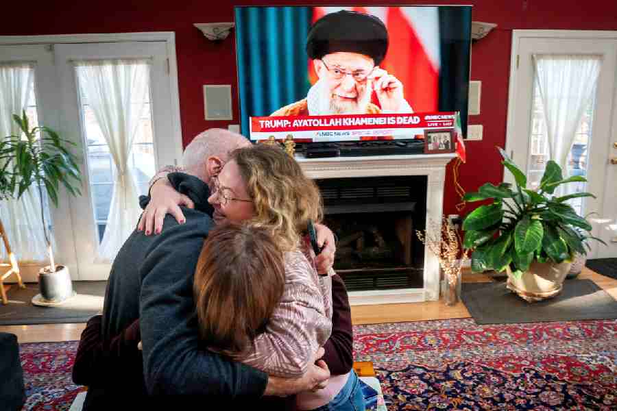 Iranian American community members and supporters of the National Council of Resistance of Iran Sadaf Ebrahimi, Shirin Nariman, and Mehran Ebrahimi react to news reports on U.S. President Donald Trump's announcement that Iran's Supreme Leader Ayatollah Ali Khamenei was killed in joint U.S. and Israeli strikes, at Nariman's home in Vienna, Virginia U.S. February 28, 2026.