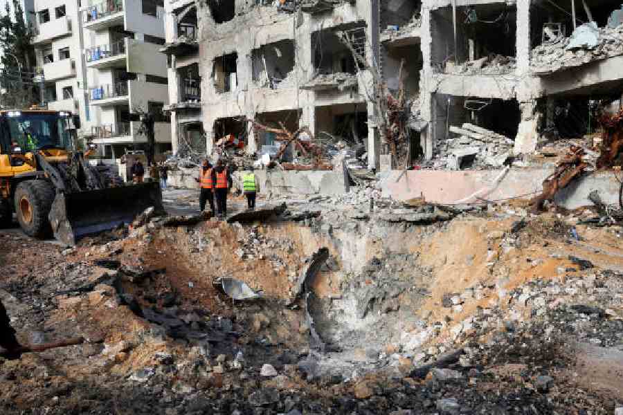 The site of an Iranian missile strike on a residential building in Tel Aviv on Sunday. (Reuters)