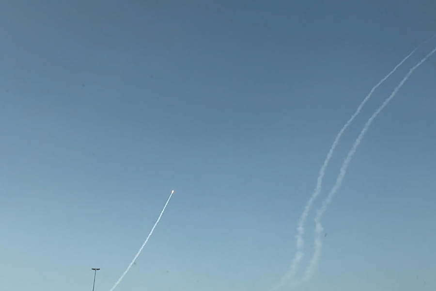 A rocket moves in the sky over Dubai