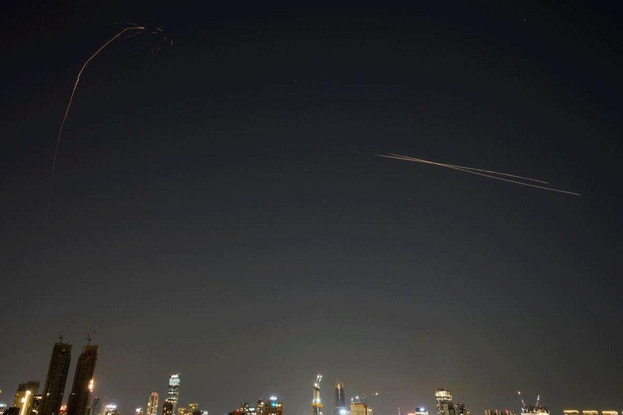 Israeli air defense system fires to intercept missiles during an Iranian attack over Tel Aviv, Israel, early Tuesday, March 3, 2026.